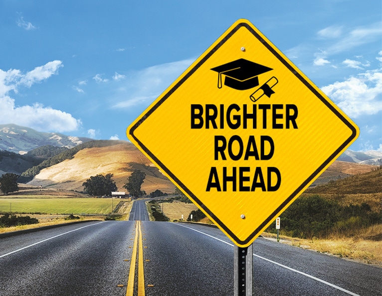 Roads sign with graduate cap