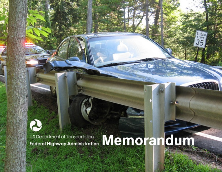 Crashed guardrail with FHWA logo