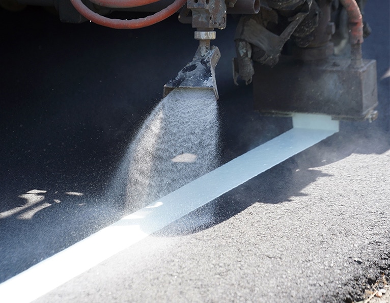 Machine painting road markings