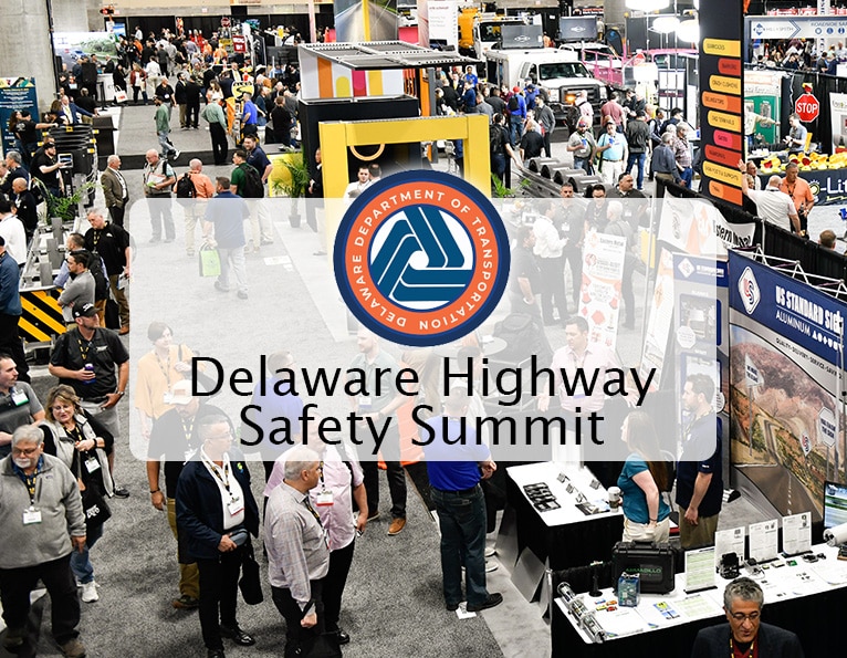 DelDOT logo on a show floor background