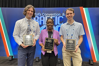 Traffic Control Device Student Challenge 2025 winners holding their plaques at ATSSA's Convention & Traffic Expo